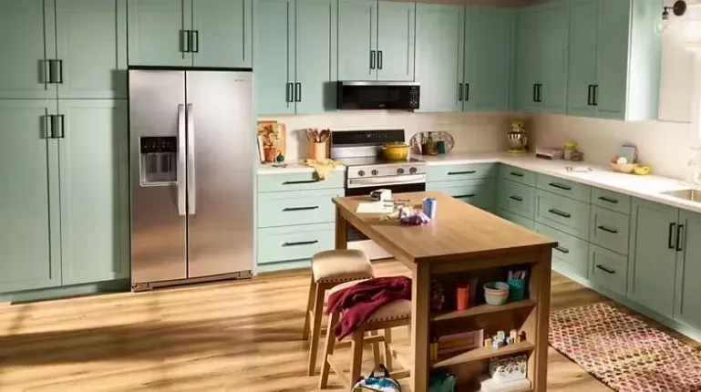 Whirlpool Side-by-Side Refrigerator WRSF6536RZ in an open kitchen featuring specialized organization bins.